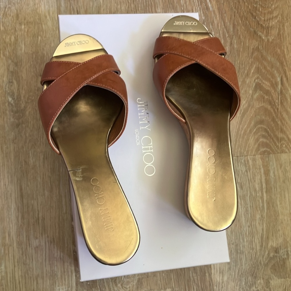 Jimmy Choo brown leather, cork bottom wedge. Comes with the box.